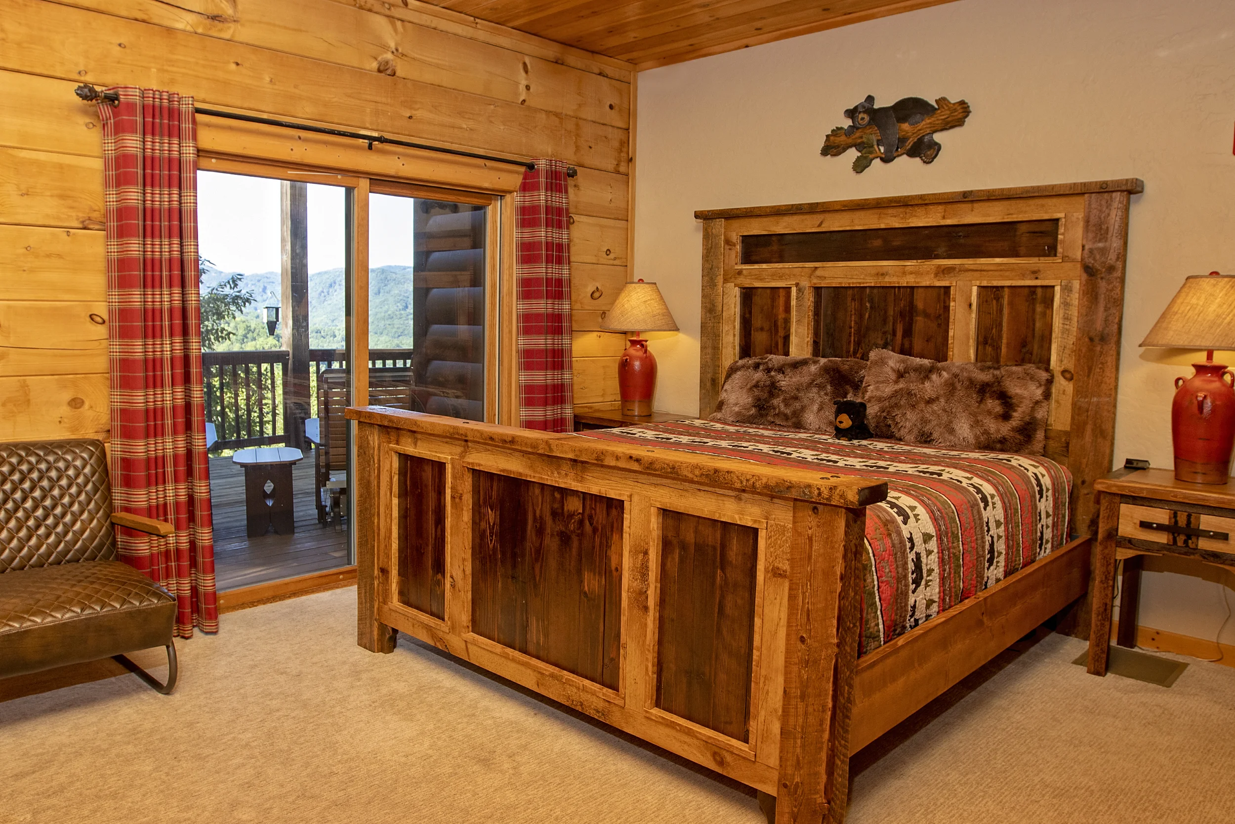 Black Bear room featuring king size bed and private balcony.
